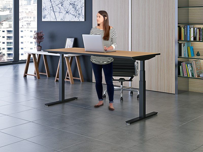 Office standing desks by Ergoville, designed for ergonomic comfort and productivity in modern workspaces.